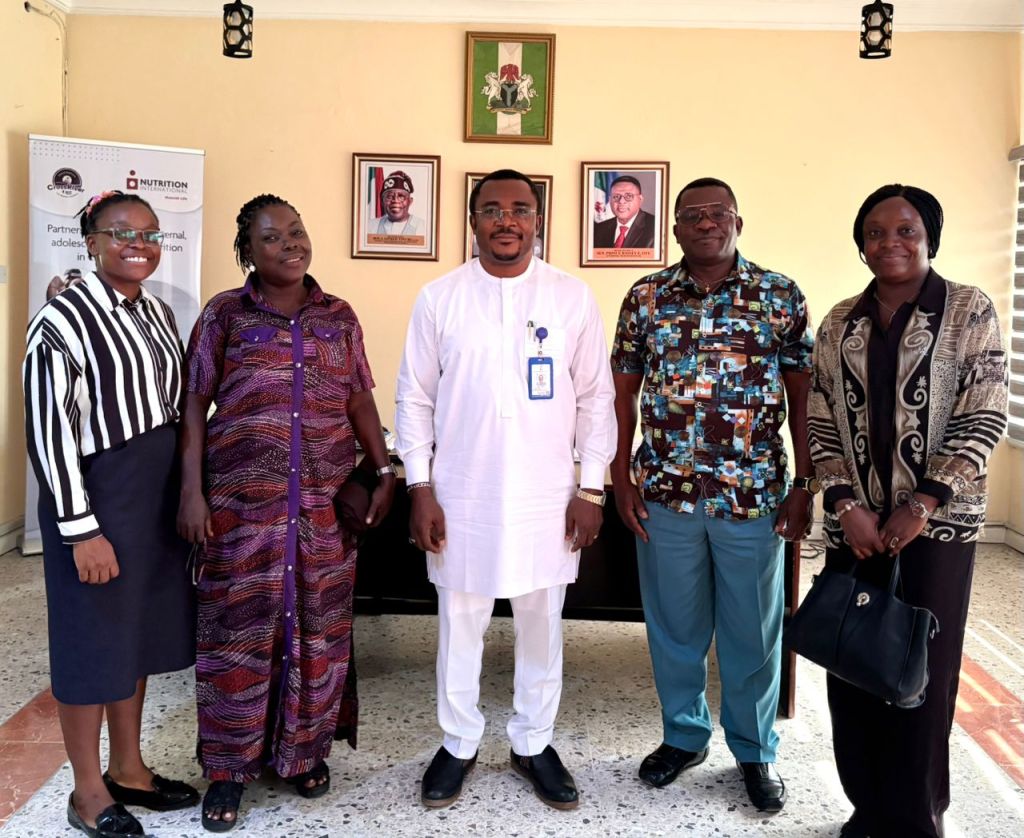 FEMinWASH exco team with Dr. Bong Duke of the State Planning Commission for Cross River.